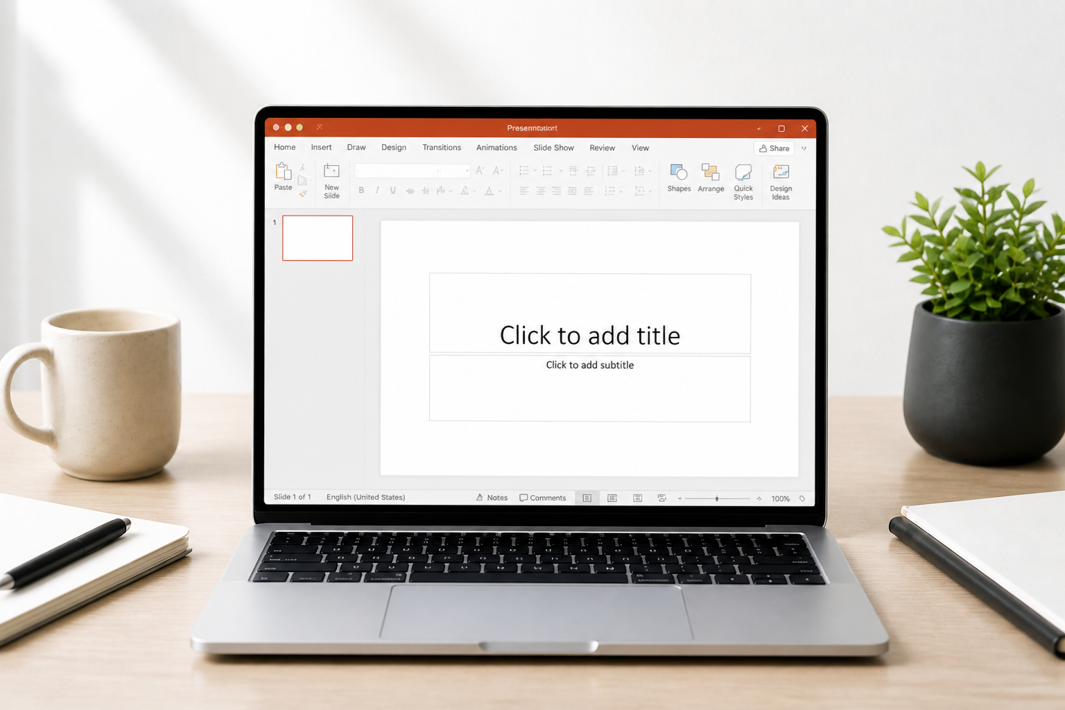 Laptop on a desk showing a blank PowerPoint slide
